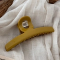 Macro detail of mustard yellow acetate hair claw clip on beige linen fabric texture - Yellow Green - Large Bar Claw