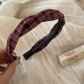 Detail view of plaid fabric headband with twist knot and non-slip toothed inner base - Twist Style - Red Plaid