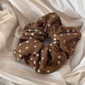 Close-up of brown polka dot fabric scrunchie with corduroy texture on linen cloth - Coffee Small Polka Dot Scrunchie