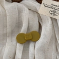 Detail of yellow-green acetate hair claw clip with wer wer embossed lettering - Yellow Green - Letter Bow Clip
