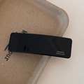 Detail of black acetate hair clip featuring a gold France Handmade logo engraving - Piano Black