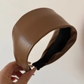 Detail view of the brown wide-brimmed PU leather headband with soft matte texture - Brown