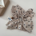Close-up of beige linen bow hair claw with colorful dots and a unique button detail - White Large Scrunchie