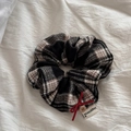 Detail of plaid fabric hair scrunchie with red bow, wooden button and happiness label - Plaid Scrunchie - Black