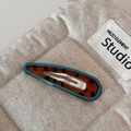Detail of leopard print hair clip with blue border and silver metal duckbill clip - Blue Edged Leopard Hollow Waterdrop