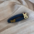 Detailed shot of navy plaid BB hair clip with cartoon dog and Tagi letters detail - Navy Blue Series - Solid Dog Clip