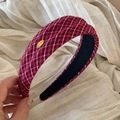 Detail of red plaid headband with golden metallic MAKE A WISH engraved logo - Red Series - Headband
