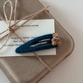 Detail of dark blue felt hair clip with flocked bear and pearl necklace detail - Blue