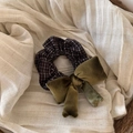 Detail view of a vintage brown checkered scrunchie with a large green velvet bow - Coffee Bowknot Scrunchie