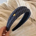 Close-up of navy plaid fabric headband with a gold Make A Wish metal plaque detail - Navy Blue Series - Headband