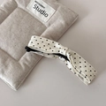 Detailed view of the polka dot fabric bow banana clip on a textured linen background - White Polka Dot Bow Vertical Clip