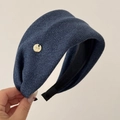 Close-up of navy blue striped fabric headband with a gold bow metal detail - Wide Headband / Navy Blue