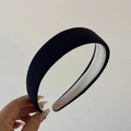 Detail view of black knitted sponge headband showing soft fabric texture and wide padded design - Patch Style / Navy Blue