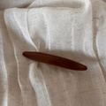 Detailed close-up of a large brown espresso hair claw clip on a natural linen background - Shimmer Coffee - Leaf Barrette
