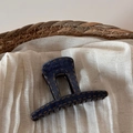 Detailed view of large denim texture hair claw with retro yellow stitching on linen fabric - Denim Blue - Short Rectangular Claw