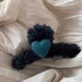 Detail of plush black faux fur hair claw clip featuring a green wool felt heart motif - Navy Blue