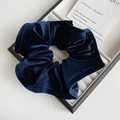 Close-up of dark blue velvet scrunchie showing ruffled texture and shiny finish - Navy Blue