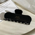 Detail of large black acetate hair claw clip with gold Barrette La France text engraving - Large French Claw Clip (FJ-0524) / Black