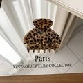 Detail of the golden Barrette La France text on a vintage leopard pattern hair claw clip - Small Size