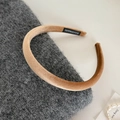 Detail of caramel velvet headband showing soft texture and handmade woven label - Light Coffee