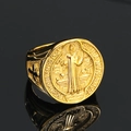 Macro detail of golden Saint Benedict medal ring showing intricate religious relief and carving - US 7 / Gold