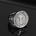 Detailed macro view of retro Saint Benedict medal engraving on stainless steel hip hop ring - US 7 / Steel