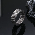 Macro detail of men's stainless steel ring with diamond grid pattern and vintage finish - US 10 / Antique Silver