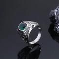 Detailed macro shot of vintage silver eagle ring with square green gemstone and relief text - US 7 / Silver Green Gemstone