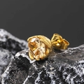 Detail view of gold stud earring with champagne stone on a natural black stone texture - Gold Tone Champagne Zircon (Single)