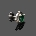 Close-up of a vintage silver stud earring featuring a vibrant green zircon gemstone - Silver With Green Zircon