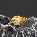Macro detail of gold oval earring with champagne zircon on volcanic rock texture - Gold Tone Champagne Zircon (Single)