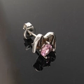 Macro shot of punk wing stud earring with pink zircon inlay and silver metal finish - Single Piece / Stainless Steel Silver Color Pink Zirconia