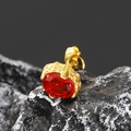 Macro detail of vintage gold earring featuring a large oval red stone and woven texture - Gold Tone Red Zircon (Single)