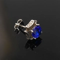 Detailed macro shot of square blue zircon stud earring with vintage silver floral metal base - Stainless Steel Silver Color Blue Zirconia