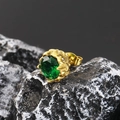 Macro detail of emerald green zircon stud earring with retro 18K gold flower setting - Gold Green Zirconia