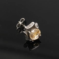 Macro view of silver titanium steel stud earring featuring champagne zircon and relief pattern - Steel Champagne Zirconia