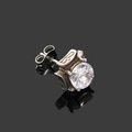 Macro detail of gothic square zircon stud earring with vintage cross engraving and silver finish - Steel Color White Zircon