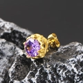 Retro gold plated stud earring with purple gemstone on a dark volcanic rock base - Gold Purple Zirconia