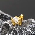 Macro shot of gold claw-set round zircon stud earring on dark textured stone - Single Piece / Gold White Zirconia
