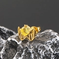 Macro detail of gothic wing stud earring with yellow zircon on black stone - Single Piece / Gold Yellow Zirconia