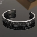 Detail of vintage silver Viking cuff featuring intricate floral vine relief patterns - Antique Floral Vine Style 14