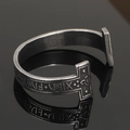 Macro shot of vintage Viking bangle with Nordic Runes and Celtic knot engravings - Antique T-Rune Style 13