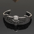 Detailed close-up of a vintage Viking skull bangle in a dark retro silver finish - Antique Skull Bone Style 12