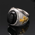 Macro view of vintage titanium steel ring featuring black gemstone and gold leaf details - US 7 / Silver Gold Black Turquoise
