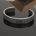 Close-up of vintage silver Viking cuff bracelet with Norse runes and Vegvisir symbol - Antique Rune Compass Style 9