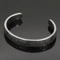 Detailed macro view of vintage Viking stainless steel cuff featuring Celtic knot patterns - Antique Ethnic Texture Style 6