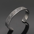 Detailed macro view of vintage Viking cuff bracelet with Celtic knot patterns in steel - Antique Celtic Knot Style 5