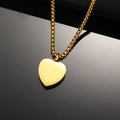 Polished gold heart perfume bottle necklace with box chain on a black reflective background - Gold Pendant Only (Without Chain)