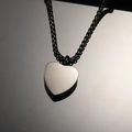 Macro shot of polished heart perfume bottle pendant on a black box chain link - Black Pendant Only (Without Chain)