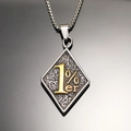 Detailed close-up of a vintage 1%er rhombus pendant with a golden text on a box chain - Pendant Only (No Chain) / Two-tone Gold Pendant (WD-735)
